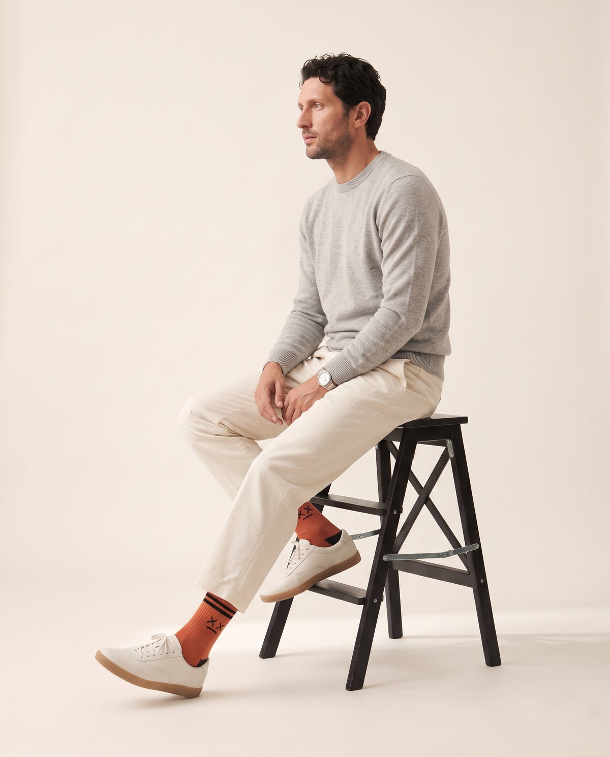 Worn: the Blood pair with a grey crewneck, cream trousers and white sneakers.
