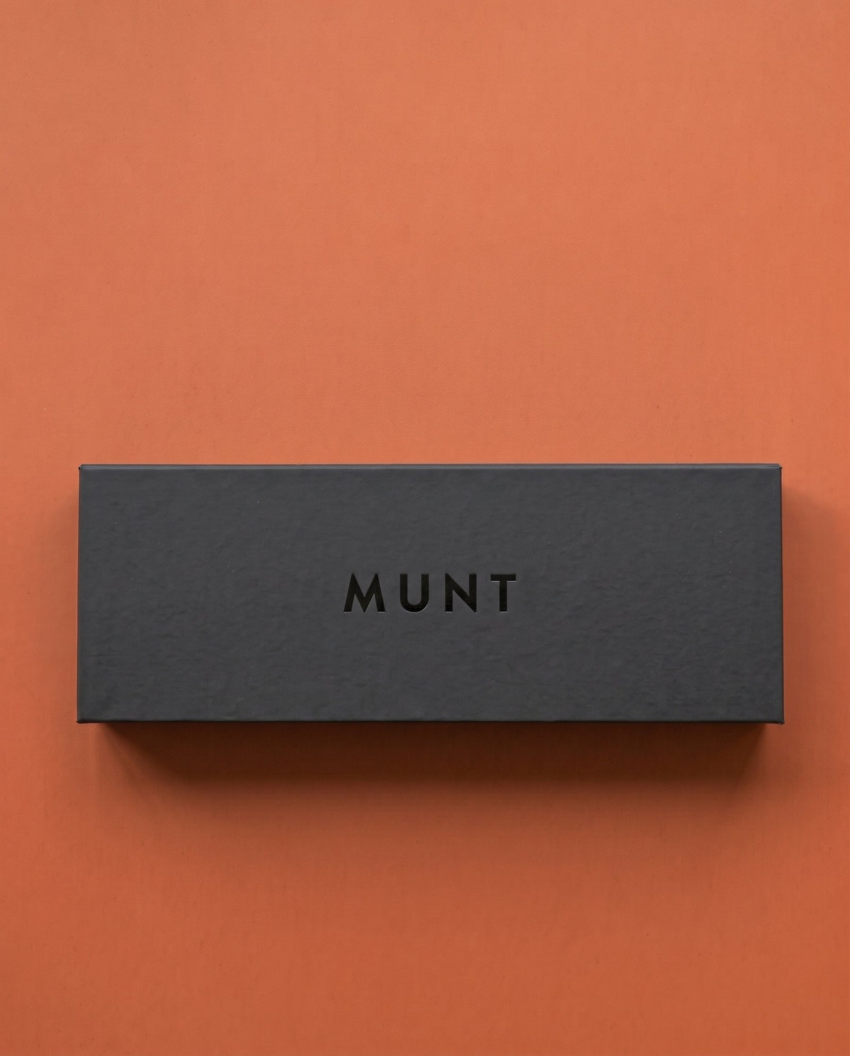 The Full Week case, closed, MUNT on the lid.